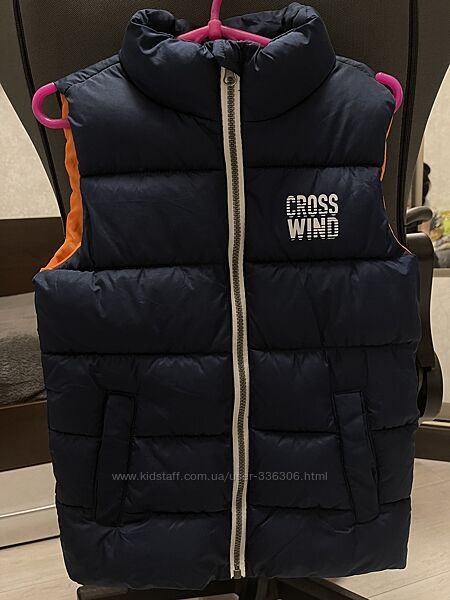 Тепла желетка на ріст 128 см