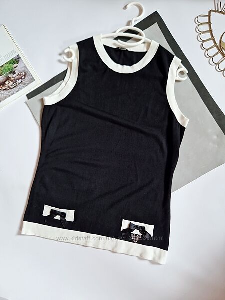 Tuzzi гарна кофтинка р 14