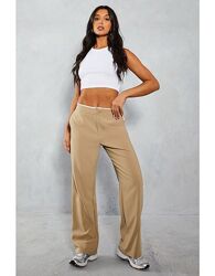 Брючки нові з контрастним необробленим верхом